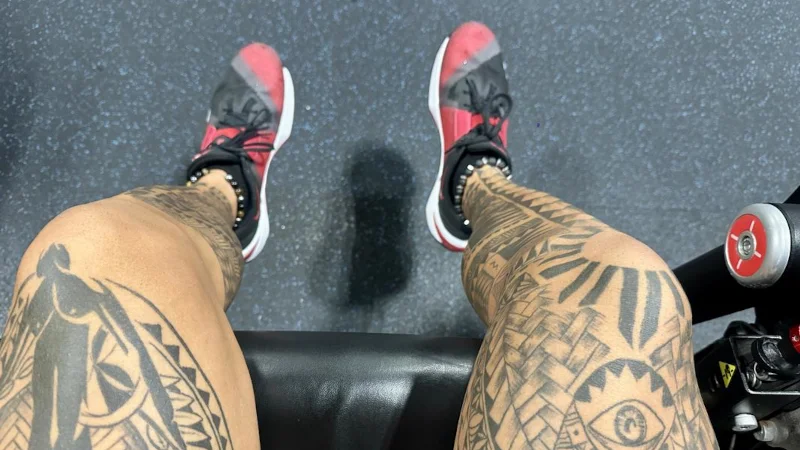 A person wearing a pair of Nike Metcon 10 training shoes