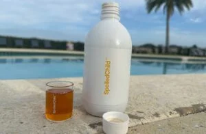 spoiledchild collagen bottle and full glass