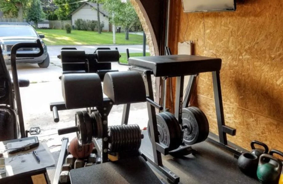 The Rogue Abram 2.0 in a garage gym with the garage door open
