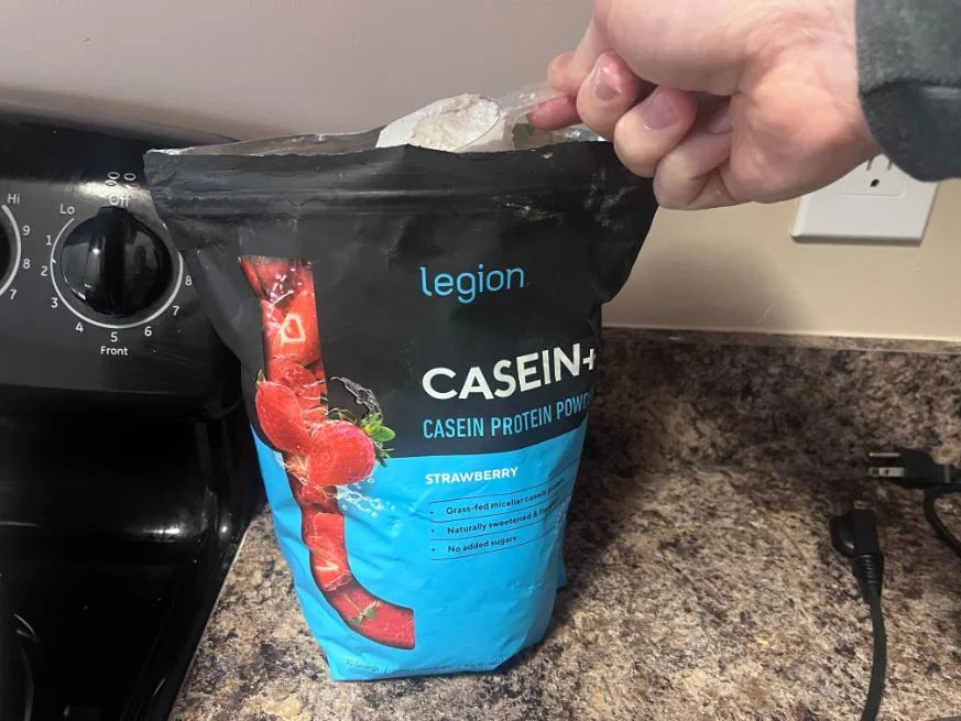 man_scooping_legion_strawberry_casein-1-1 man_scooping_legion_strawberry_casein 1 1