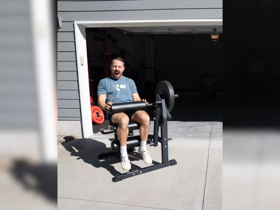 Titan leg curl machine in use