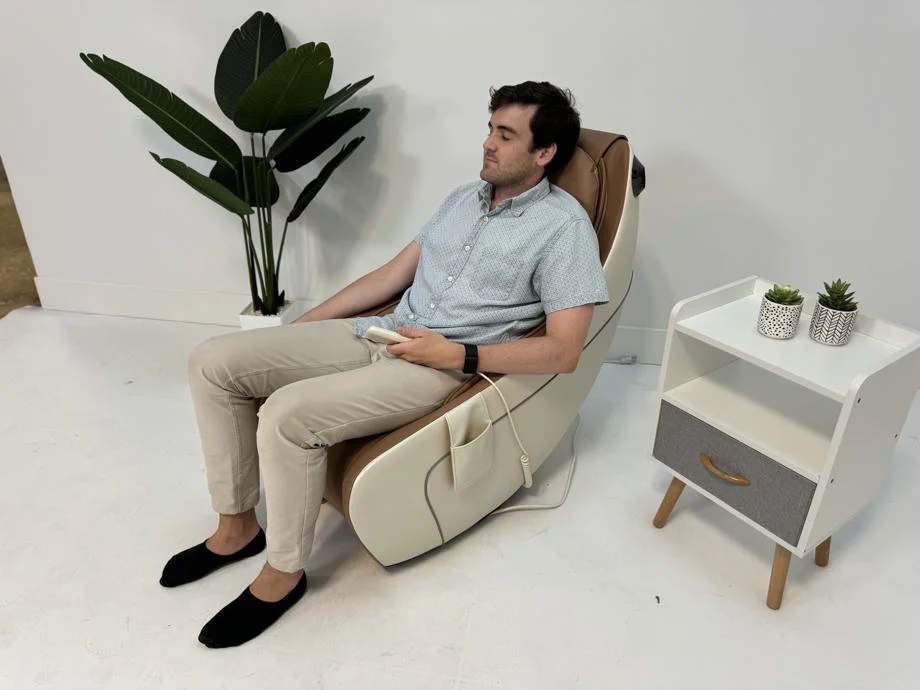 A person using the Synca Wellness CirC Massage Chair