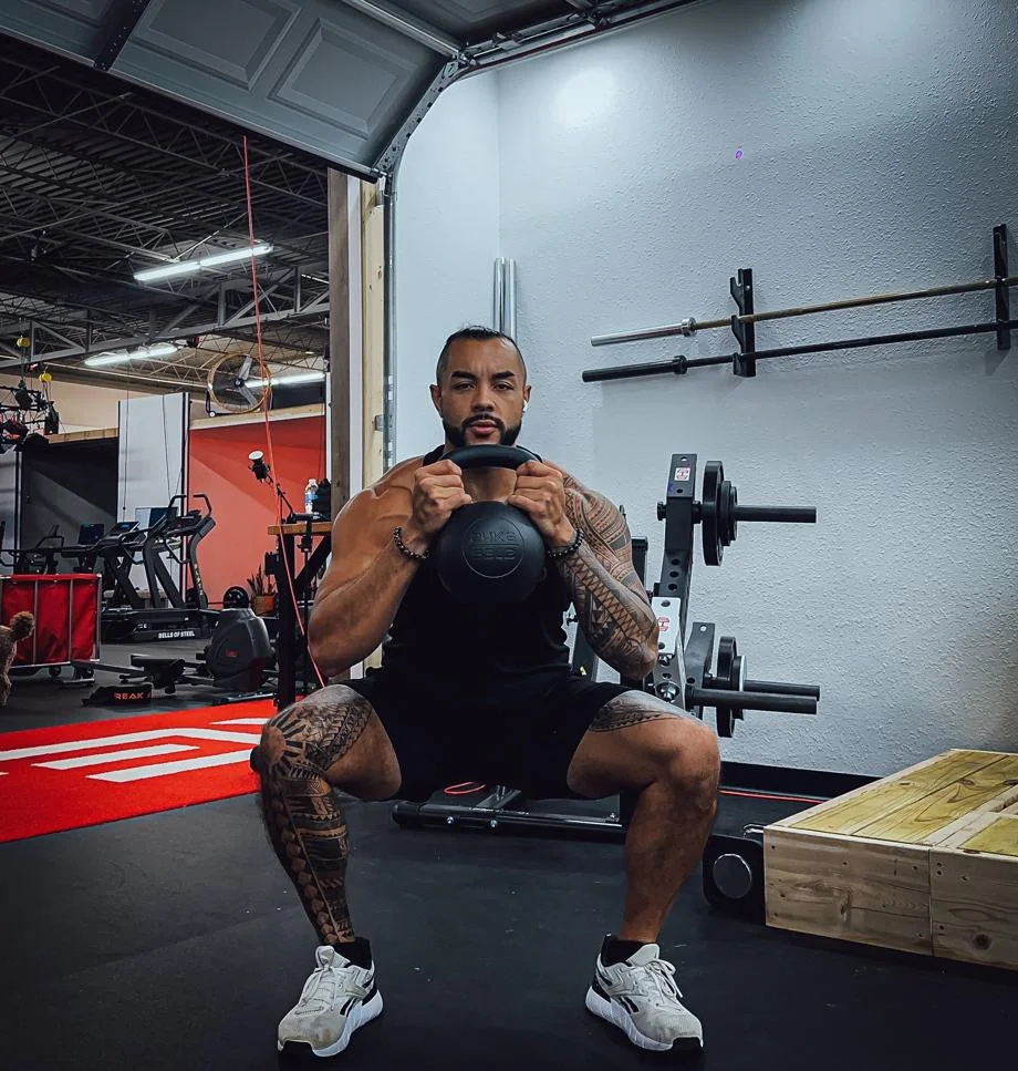 Stephen Sheehan, CPT, CNC, performs a goblet squat with a Giant v3 24kg Kettlebell