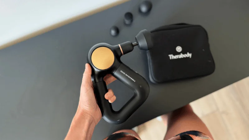 Our tester holding the Therabody Theragun Sense