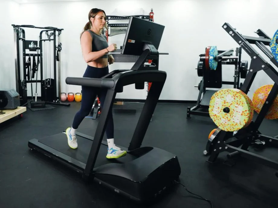 A person running on an Aviron Victory Treadmill