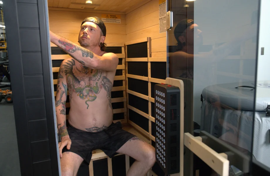 Our tester sitting inside the SaunaBox Solara before a sweat session