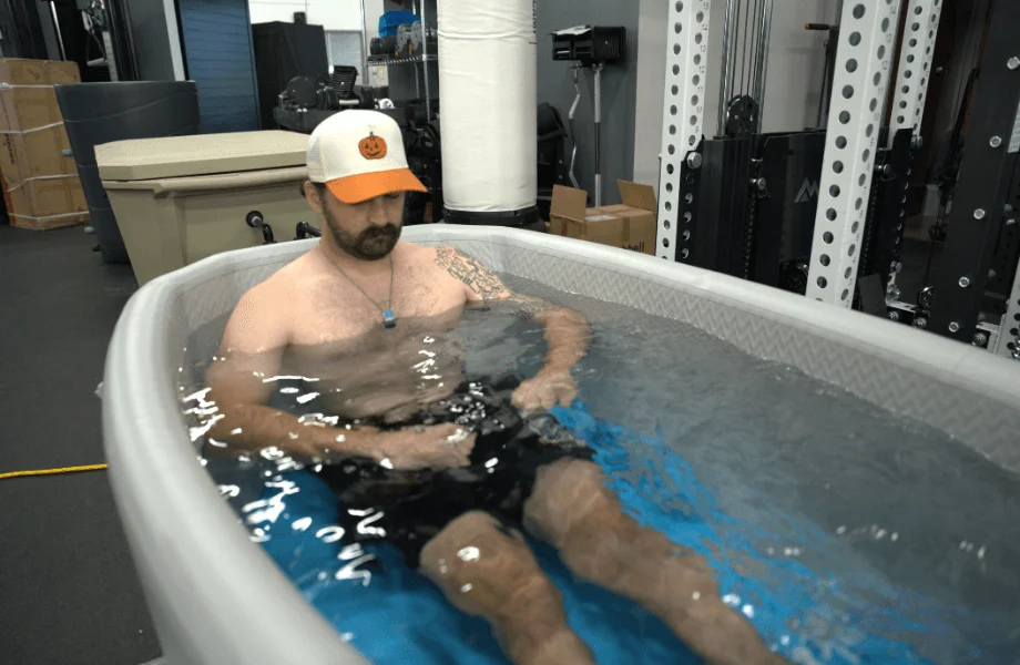 Our tester soaking in the Plunge Air inflatable cold plunge tub