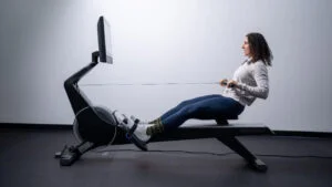 amanda using rowing machine legs extended 1