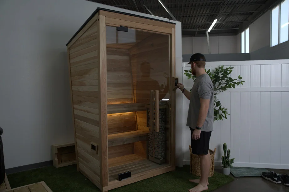 Our tester Tristan entering a Plunge The Sauna Mini
