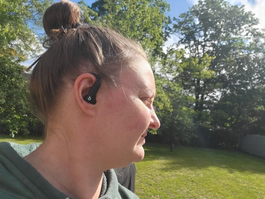 Our tester wearing PowerBeats Pro 2 wireless earbuds.
