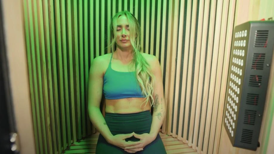 Expert tester Lindsay Scheele, CPT, relaxes in a Sun Home Pod Sauna.