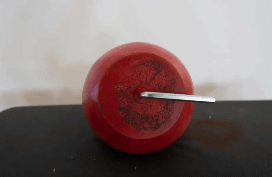 The Allen key locking mechanism featured on the base of the Titan Fitness Adjustable Competition-Style Kettlebell