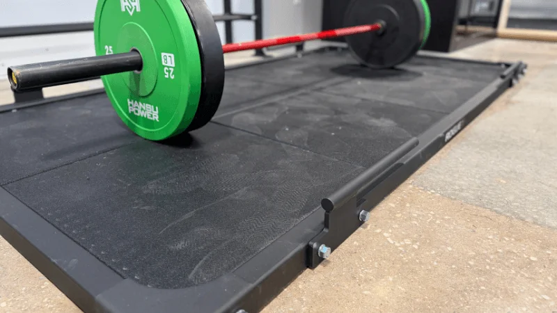 A loaded barbell on the Rogue Deadlift Platform