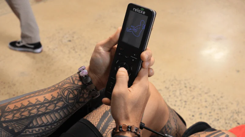 The handheld remote control for the Relaxe Zero-Gravity Shiatsu Massage Chair