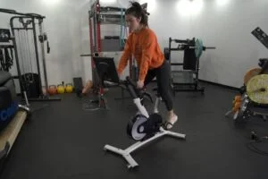 a woman rides on a free beat boom bike