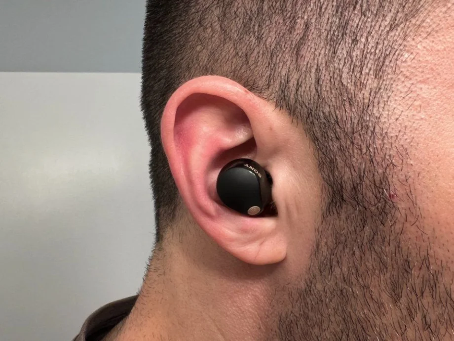 A close look at a Sony WF-1000XM5 wireless earbud being used by our product tester.