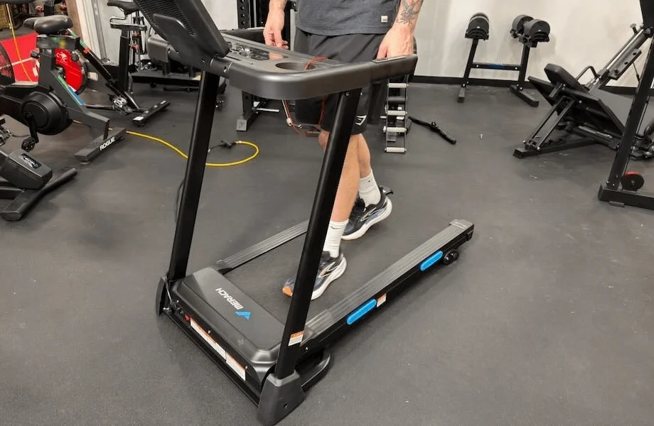 Our tester walking on the Merach T12 treadmill