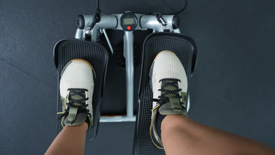 feet on the sunny health and fitness mini stepper