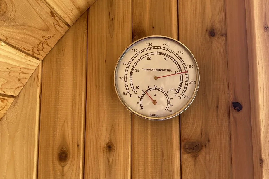 A close-up of the Almost Heaven Barrel Sauna thermometer