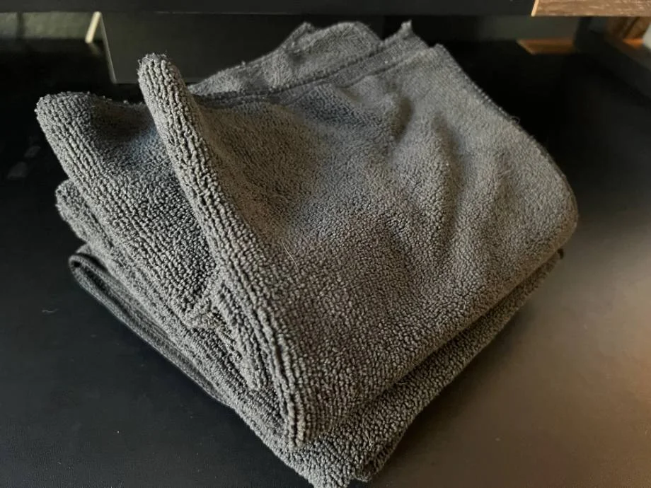 A stack of folded gray towels