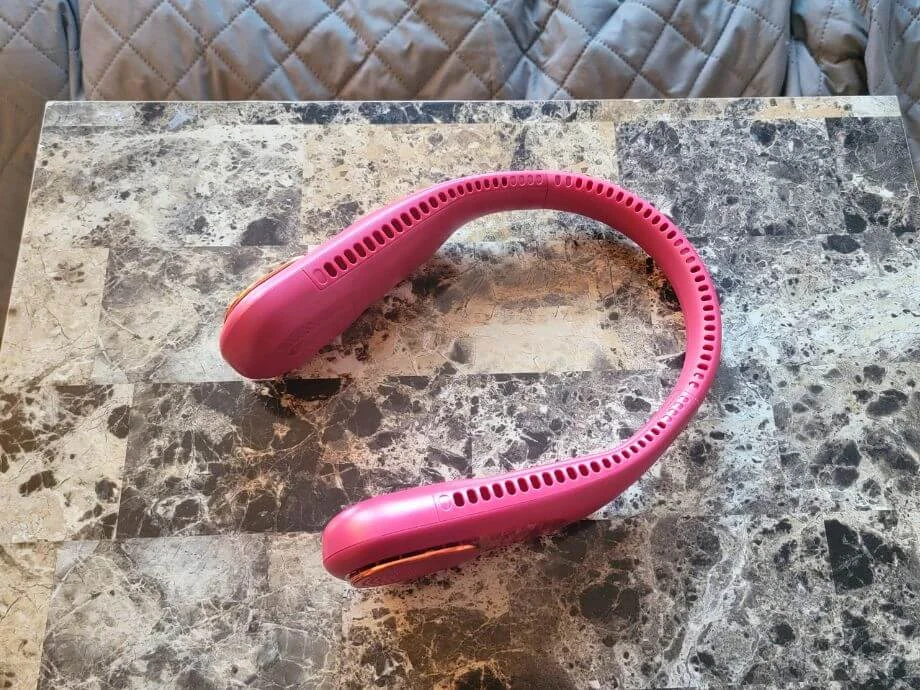 An image of the SWEETFULL Neck Fan from the top, showcasing the many air outlets along the neckband