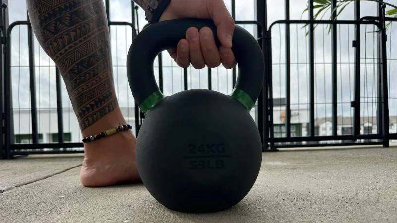 Our tester grips the handle of an Iron Bull Strength Kettlebell
