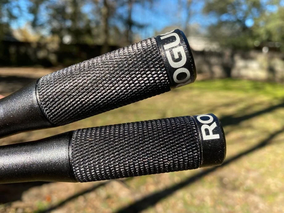 Close-up of the Rogue Fitness SR-2 3.0 Jump Rope&nbsp;handles, emphasizing the black precision-machined aluminum handles with tapered grips.