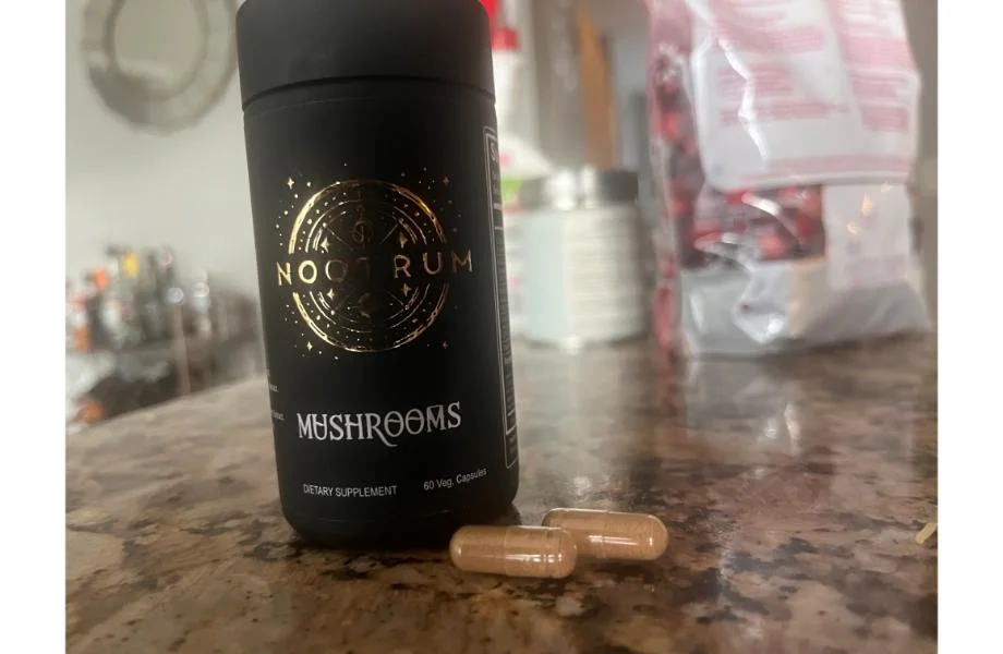 person_taking_nootrum_mushroom_capsules 1