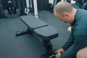 person using rep nighthawk bench