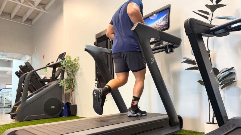 A man running on the Peloton Tread+ treadmill