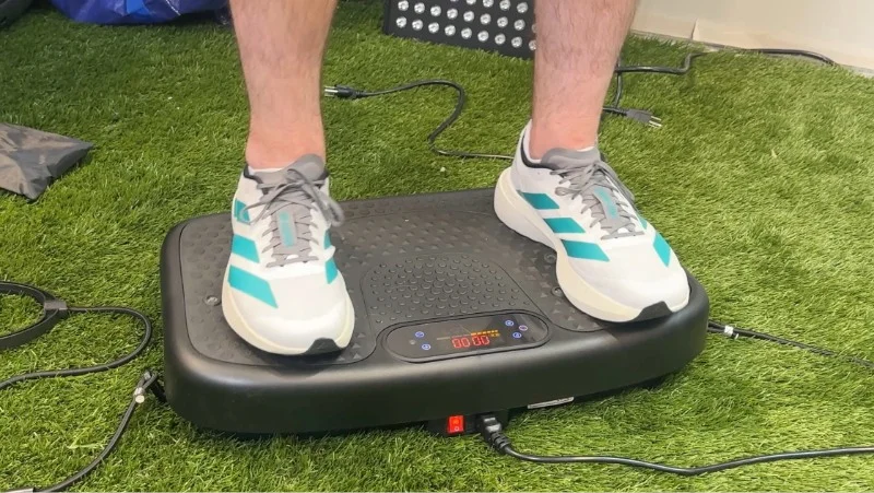 Our tester stands on the SoftGym Vibration Plate