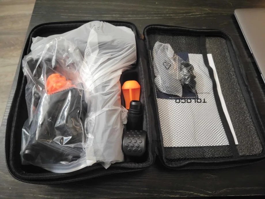 The TOLOCO Massage Gun just out of its box