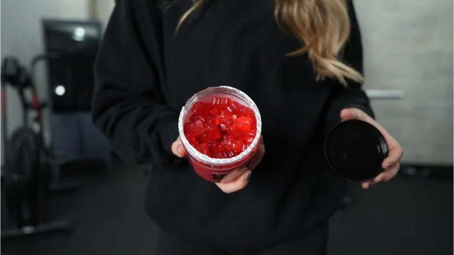 Looking down into an opened tub of Swoly Creatine Gummies.