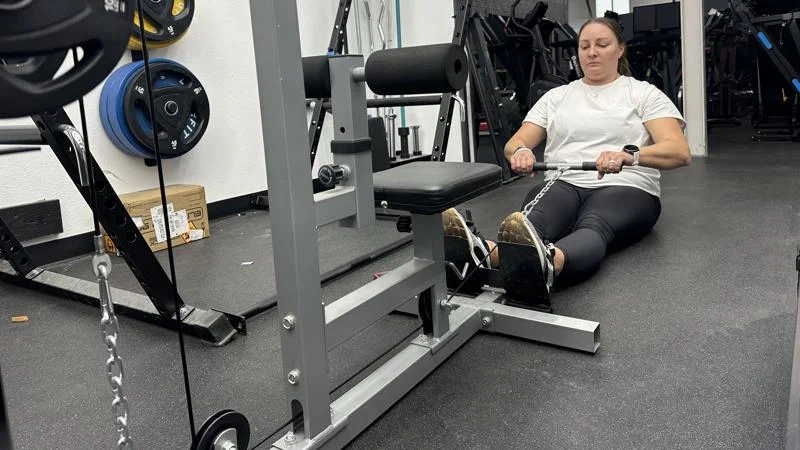 Our tester doing low rows with the GDLF Lat Pulldown Machine
