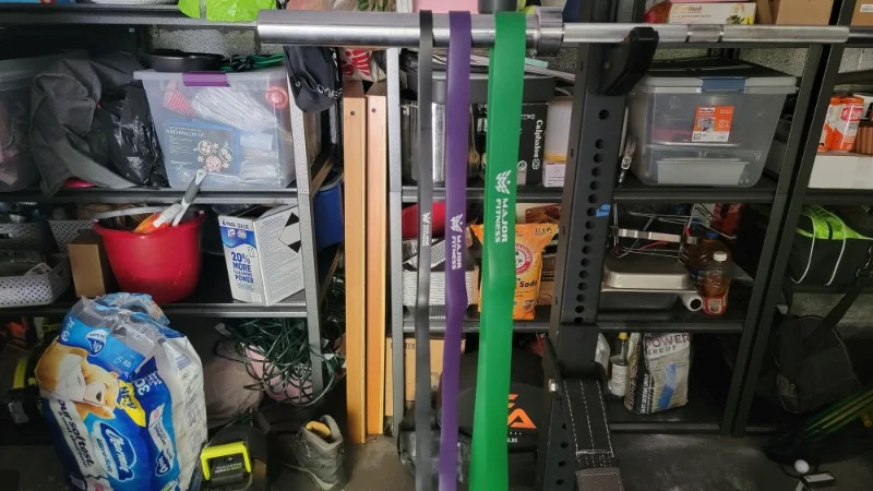 A set of Major Fitness Pull-Up Assist Bands hanging from a bar