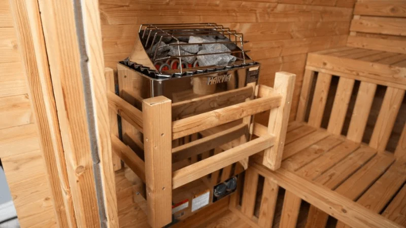 The Harvia electric heater available with the Redwood Outdoors Thermowood Cabin sauna