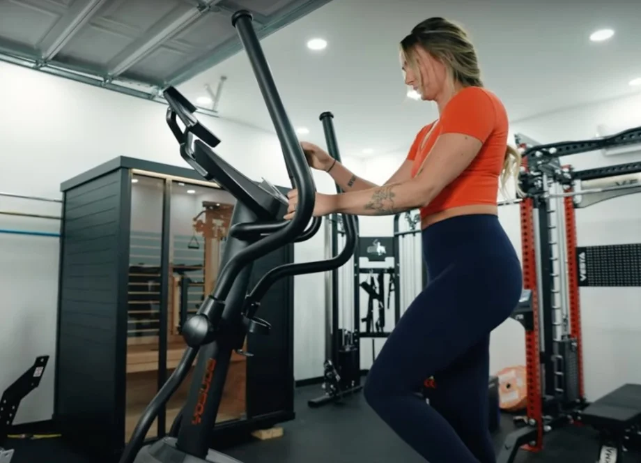 A woman working out using the Yosuda Elliptical