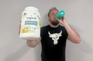 man_drinking_organifi_complete_protein_powder