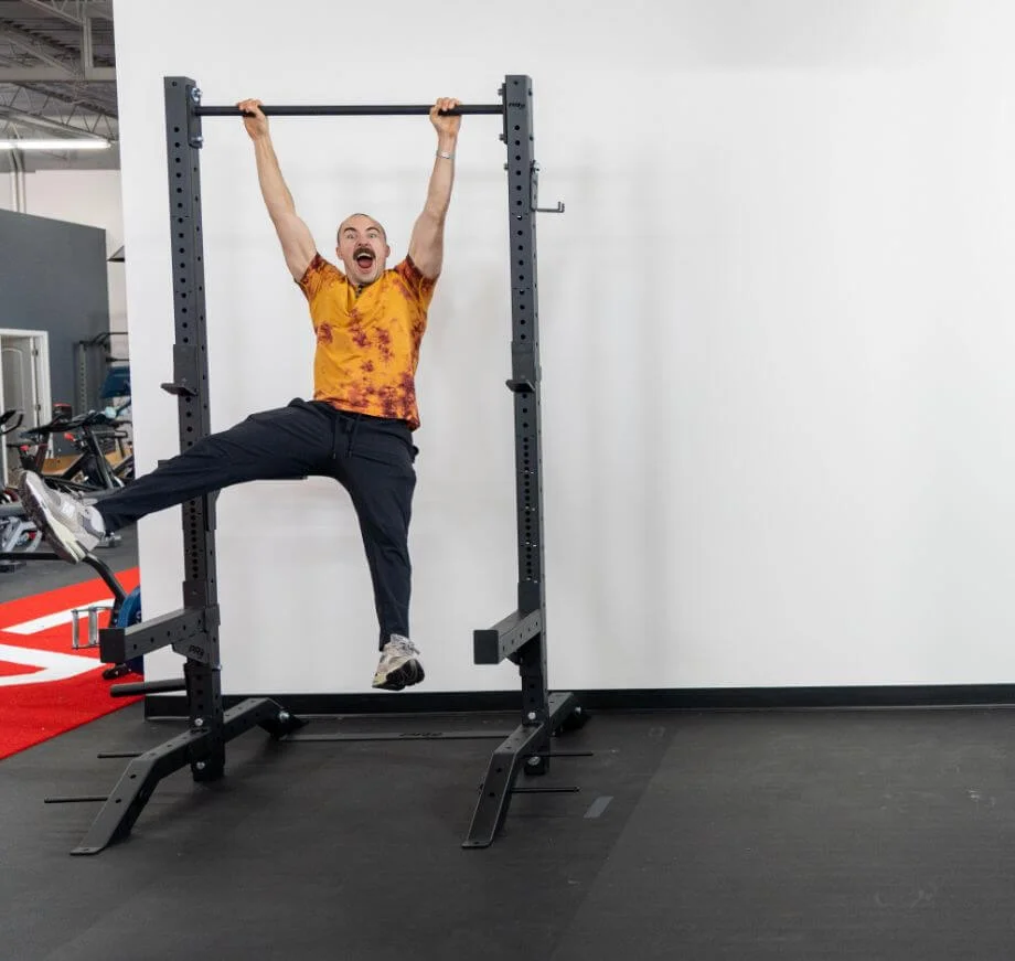 coop hanging on pull-up bar PRx Build Limitless Rack