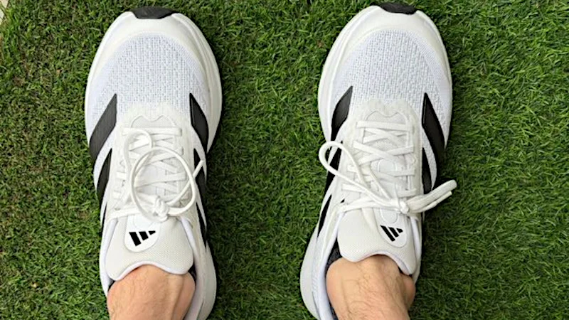 Looking down at a pair of adidas Duramo SL2s