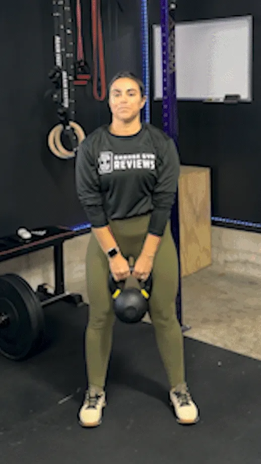 woman doing Kettlebell Front Shrugs
