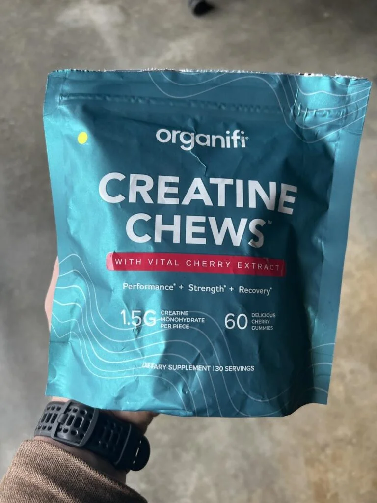 Holding a bag of Organifi Creatine Chews