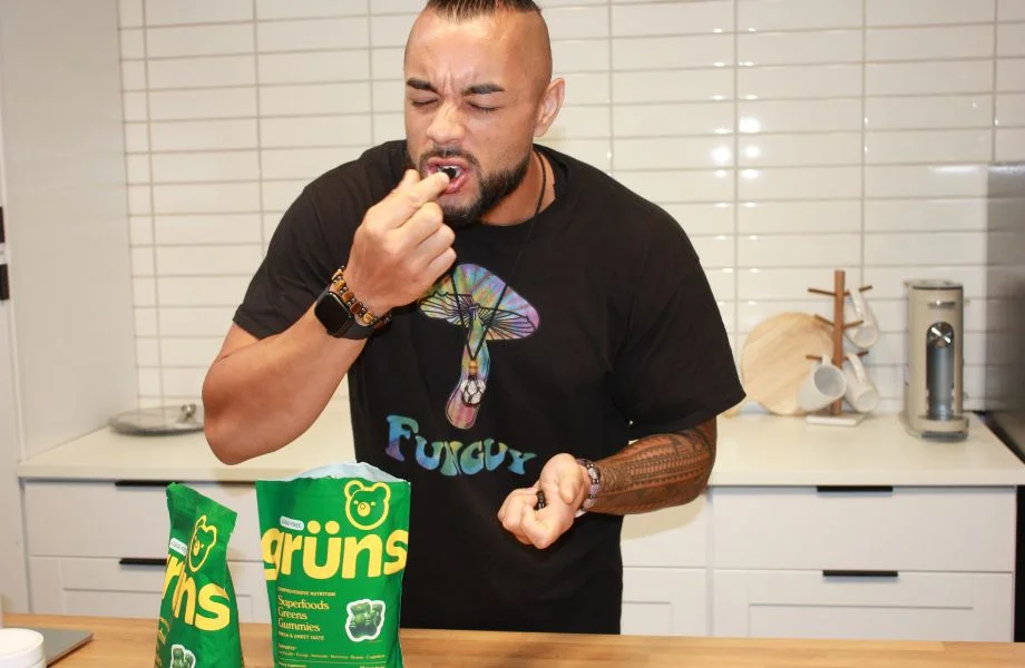 Man eating Grüns gummies
