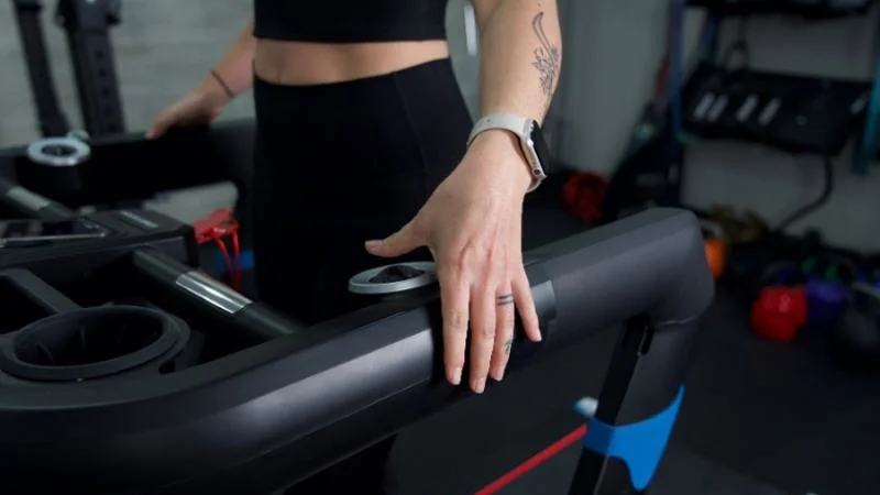 Thumb controls on the armrest of the Echelon Stride 8s treadmill.