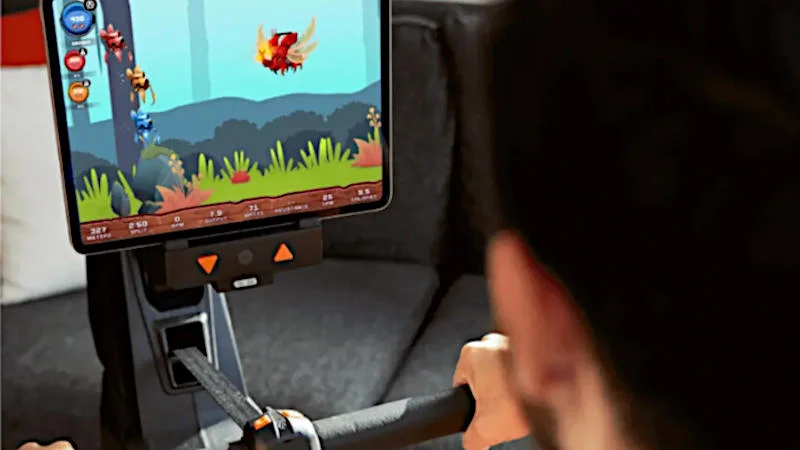 Looking over our tester's shoulder while they do a gamified workout routine on an Aviron Strong Series rowing machine