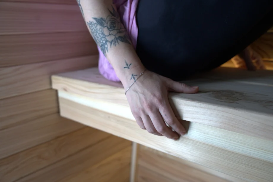 Our tester holds the thick bench in a Plunge Sauna Mini