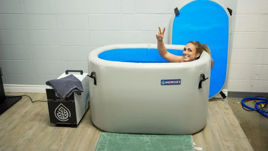 Woman in the Inergize cold and hot plunge tub