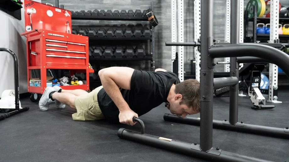 Man doing push-ups on the Weider Power Tower