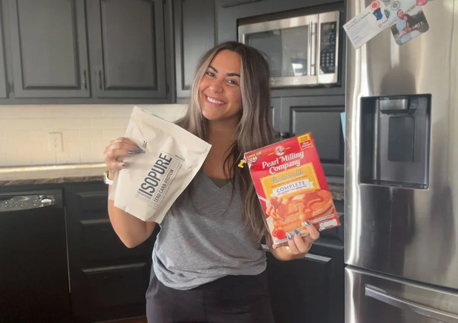 woman-holding-isopure-protein-whey-unflavored-pancake-mix