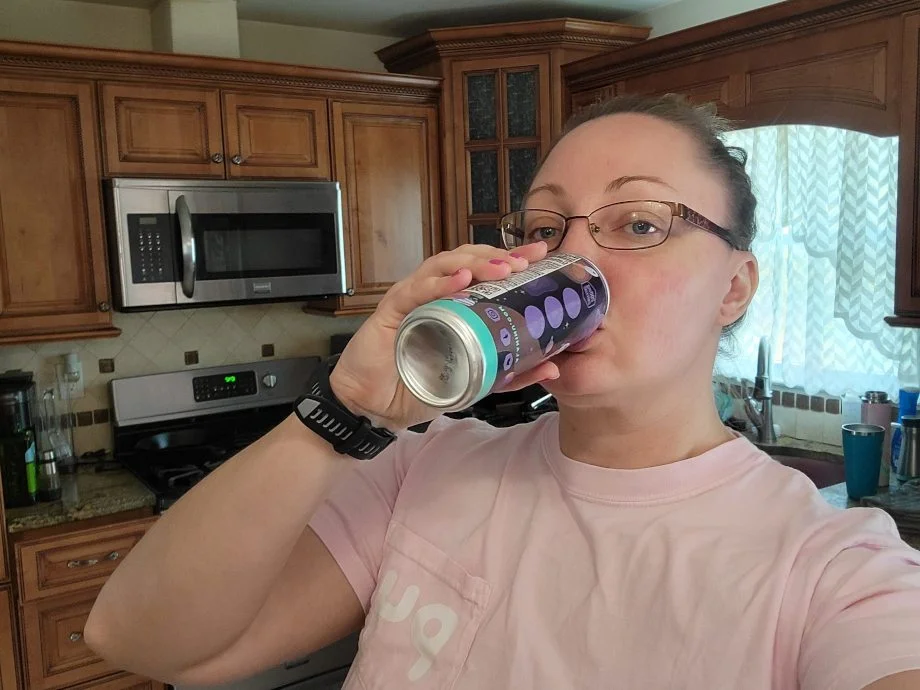 Our tester drinking an Alani Nu Energy Drink